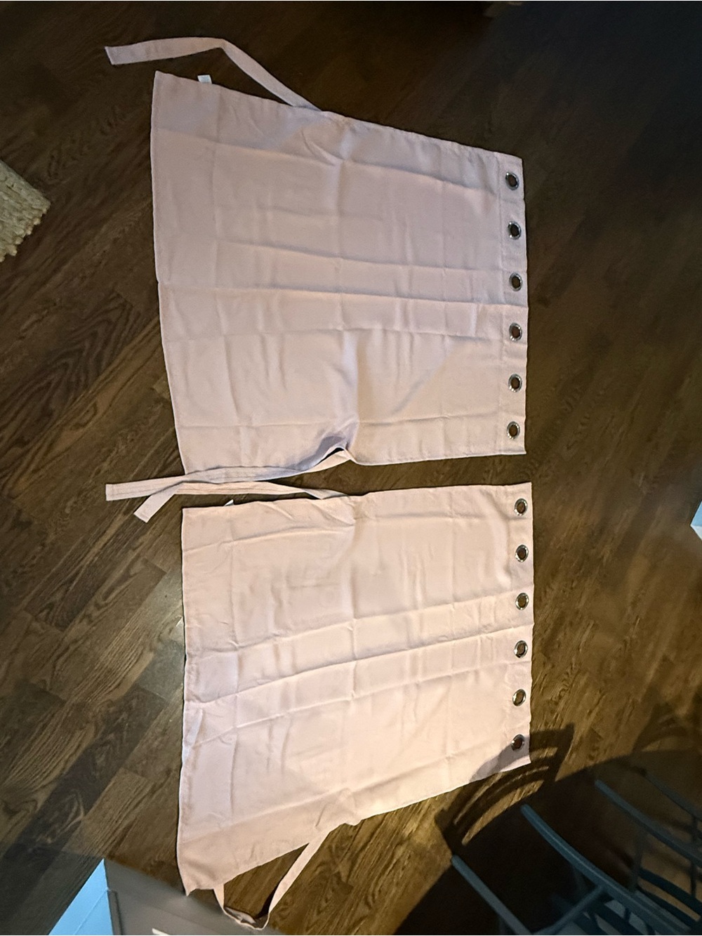 Light pink curtains (2 panels) with ties. Silver grommets.